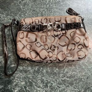 Small wristlet with carrying strap